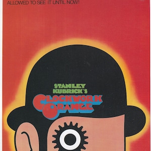 May include: A movie poster for the film "A Clockwork Orange" directed by Stanley Kubrick. The poster features a close-up of a man's face with a black bowler hat and a large gear in his eye. The background is a gradient of orange and red.