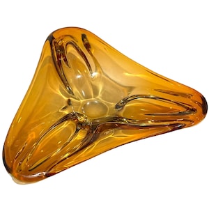 May include: A white ceramic mug with a black handle and the text "But First, Coffee" in a black, bold font. The mug is on a white surface. The mug is 4 inches tall.