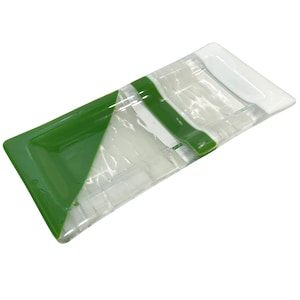 May include: A rectangular glass dish with a green and white design. The dish has a textured surface and a raised edge.