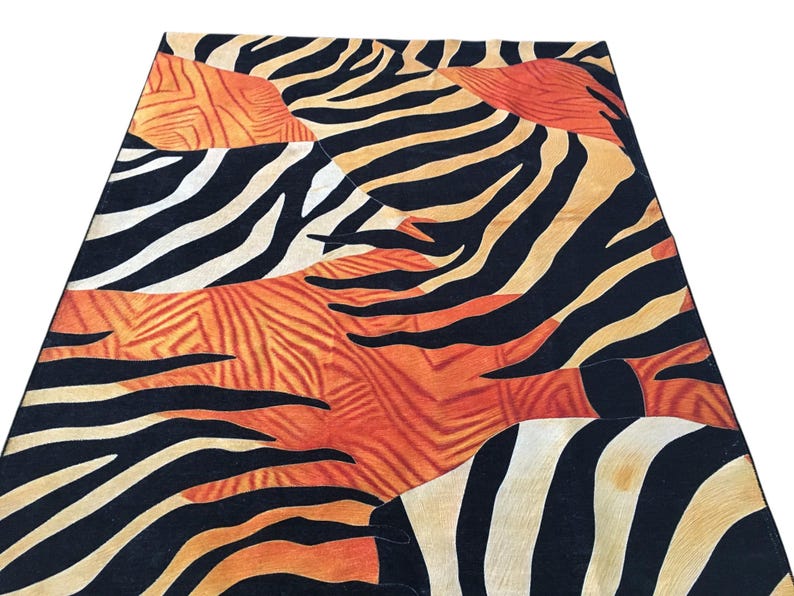 a vibrant and bold pattern of black and orange stripes, resembling the distinctive markings of a zebra.