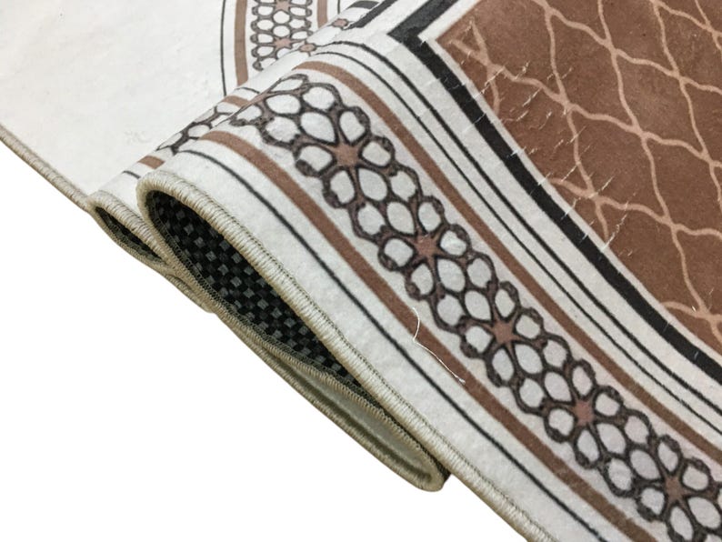 a close-up view of a decorative rug with a floral pattern.