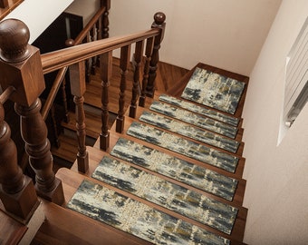 May include: A set of six non-slip stair treads featuring an abstract pattern in shades of grey, beige, and gold. The treads are placed on a wooden staircase with a brown handrail.