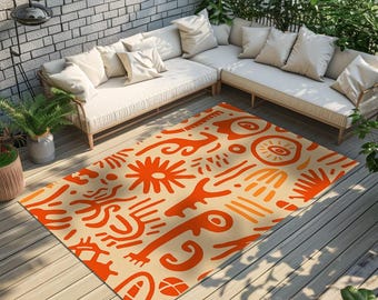 May include: A rectangular area rug featuring a cream-colored background with a repeating pattern of abstract orange shapes, including sun-like motifs, curved lines, and organic forms, laid out on a wooden deck in front of a sectional sofa.