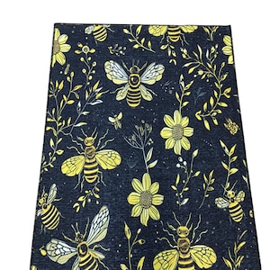 a black and yellow floral pattern with bees and flowers.