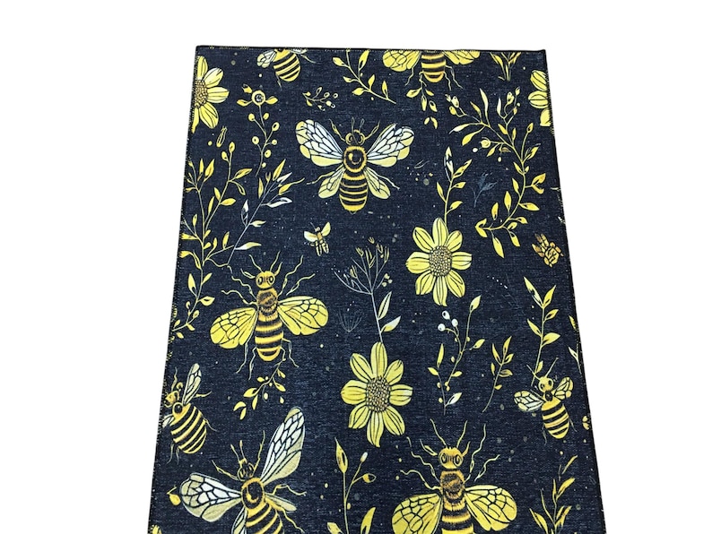 a black and yellow floral pattern with bees and flowers.
