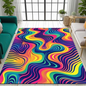 May include: Abstract area rug with a colorful, wavy pattern in shades of blue, yellow, pink, green, and orange.