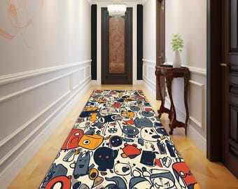 May include: A colorful hallway runner rug with a repeating pattern of cartoon characters in various shapes and colors, including red, orange, blue, and black. The rug is rectangular and placed on a light-colored wooden floor.
