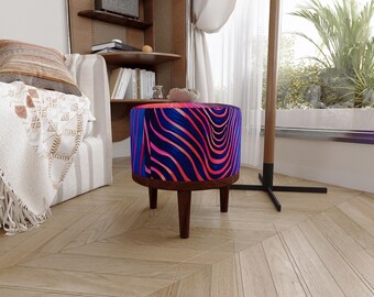 May include: A round ottoman featuring a vibrant pattern of wavy, flowing lines in shades of bright pink and deep blue. The seat is supported by four dark brown wooden legs, providing a stable base for this circular piece of furniture.