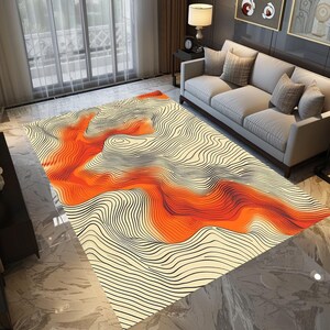 May include: Abstract area rug with a white background and orange and black wavy lines. The rug has a modern design.