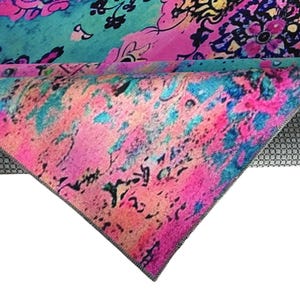 a vibrant, multicolored fabric with a floral pattern. The fabric appears to be a rug or textile with a bold, abstract design.