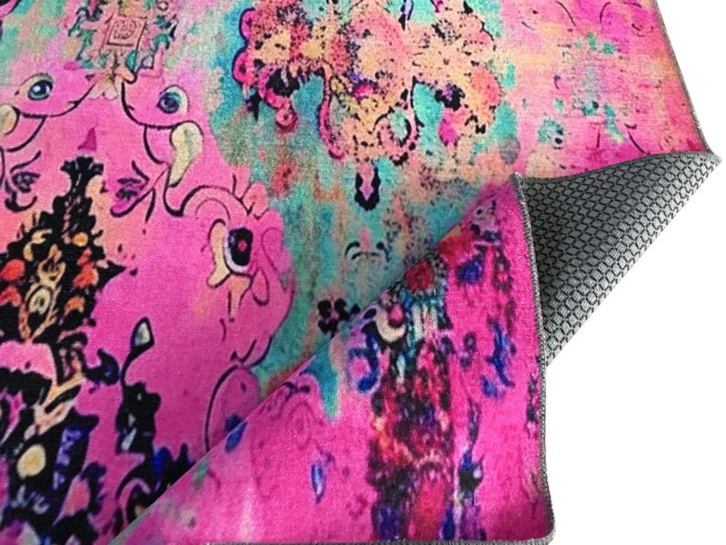 a vibrant, colorful, and abstract pattern with various shades of pink, blue, and green. The pattern appears to be a textile or fabric design, with a mix of organic and geometric shapes and patterns. The image does not contain any text or specific objects, and the focus is on the visual elements and the overall composition of the design.