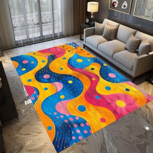 May include: Abstract area rug with a colorful design featuring yellow, blue, pink, and red wavy lines and polka dots.