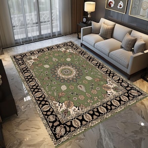 a large, ornate rug with a floral design in shades of green and black, placed on a tiled floor in a living room setting.