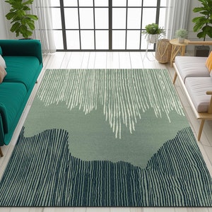 May include: A green and blue abstract area rug with a striped pattern. The rug has a light green background with white and dark blue stripes.