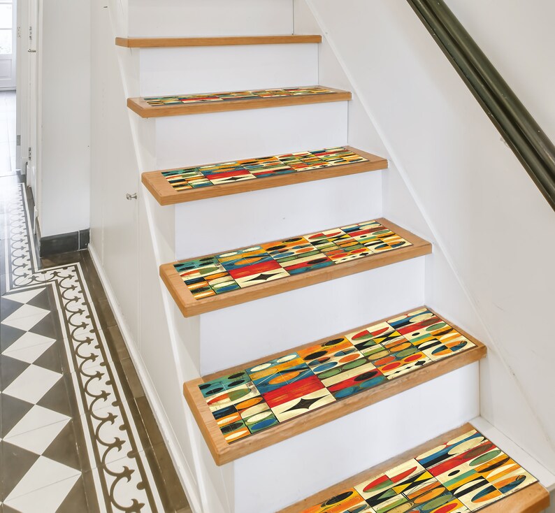 May include: A set of colourful geometric patterned non-slip stair treads. The treads are made of a durable material and are designed to help prevent slips and falls on stairs.