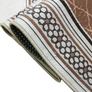 a close-up view of a decorative rug with a floral pattern.