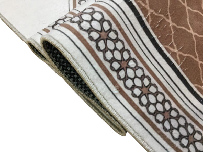 a close-up view of a decorative rug with a floral pattern.