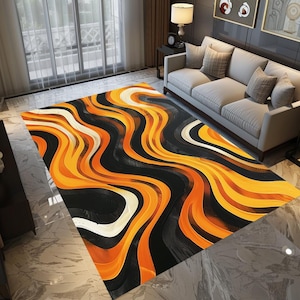 May include: Abstract area rug with a wavy pattern in black, orange, and white. The rug has a modern design and would add a bold statement to any room.