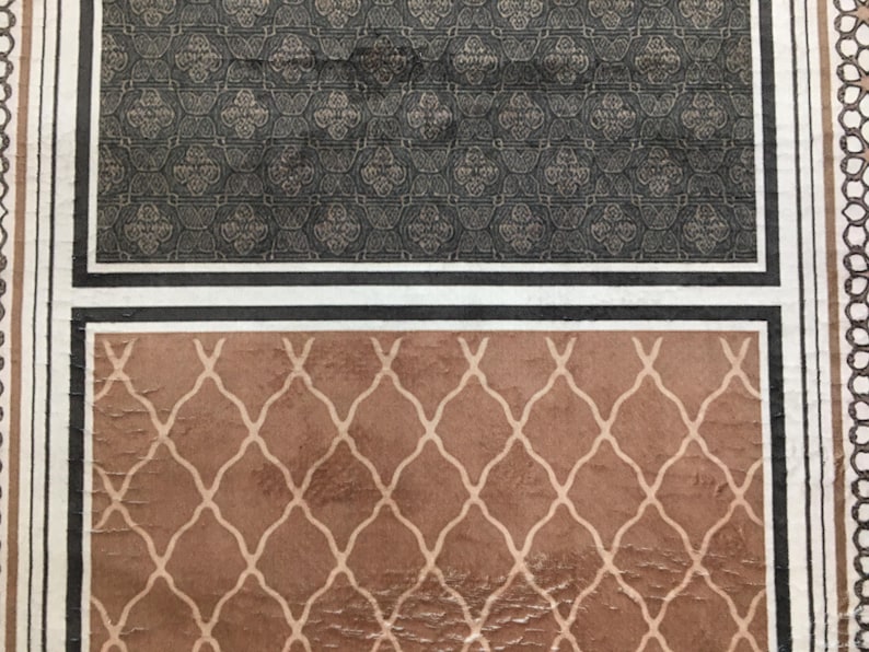 two distinct patterns, one with a black and white geometric design and the other with a brown and white diamond pattern.