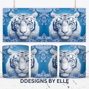 May include: White tiger with blue eyes on a blue background with a white and blue floral pattern. The image is repeated on two mugs.