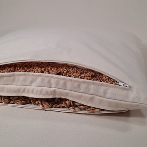 Combined pillow made of organic millet husks and organic spelt husks, with two filling chambers