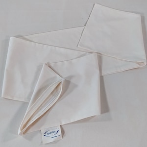 May include: A white cotton pillowcase with a zipper opening. The pillowcase has a small blue label with the text "Spritex one size fits all".