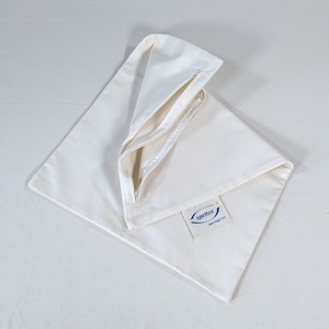 May include: A white canvas zippered tote bag with a blue logo that says "SpeltEx" and "draw string bag mini".