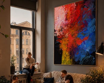 May include: A large rectangular wall art piece featuring an abstract composition of vibrant red, blue, yellow, and black paint strokes. The artwork is displayed in a wooden frame and hangs on a gray wall above a beige sofa in a living room setting.