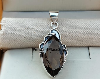 Pingente artesanal de quartzo fumê: pedra preciosa em prata de lei 925.