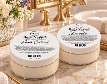 May include: Two round clear plastic jars of Body Yogurt Light Moisture Jelly Lotion with white screw-top lids. One label reads Apple Orchard, the other Lavender. Both labels list ingredients, Net Wt: 8 oz, and the website casuallycreativecrafting.com.