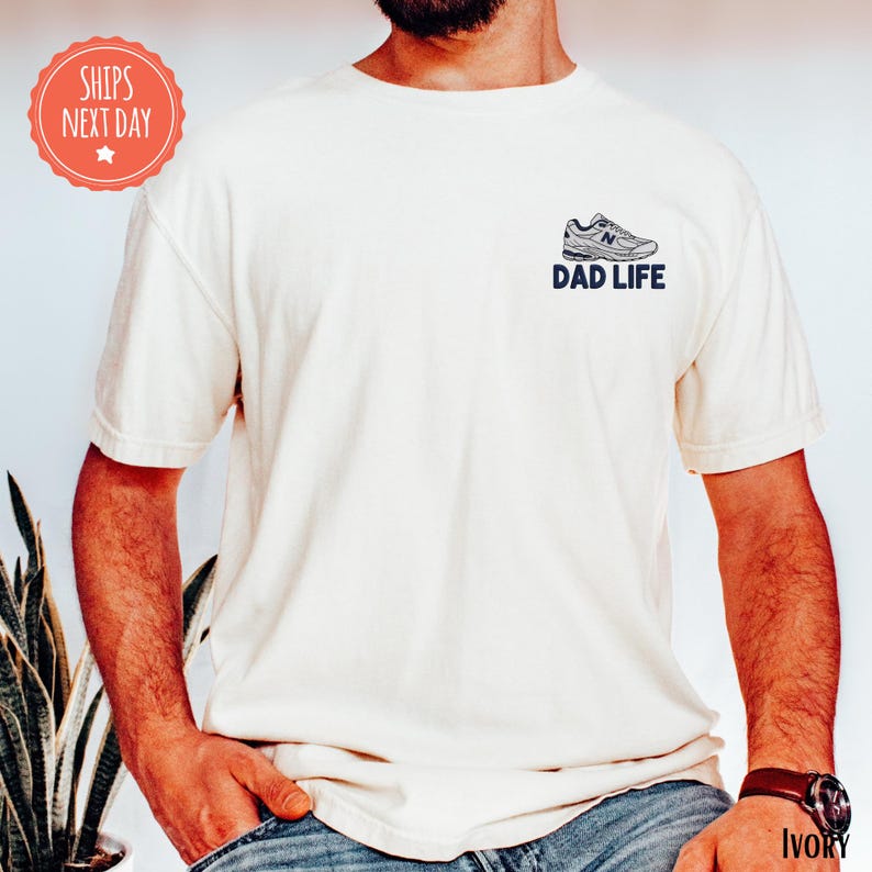 a man with a beard wearing a dad life t - shirt