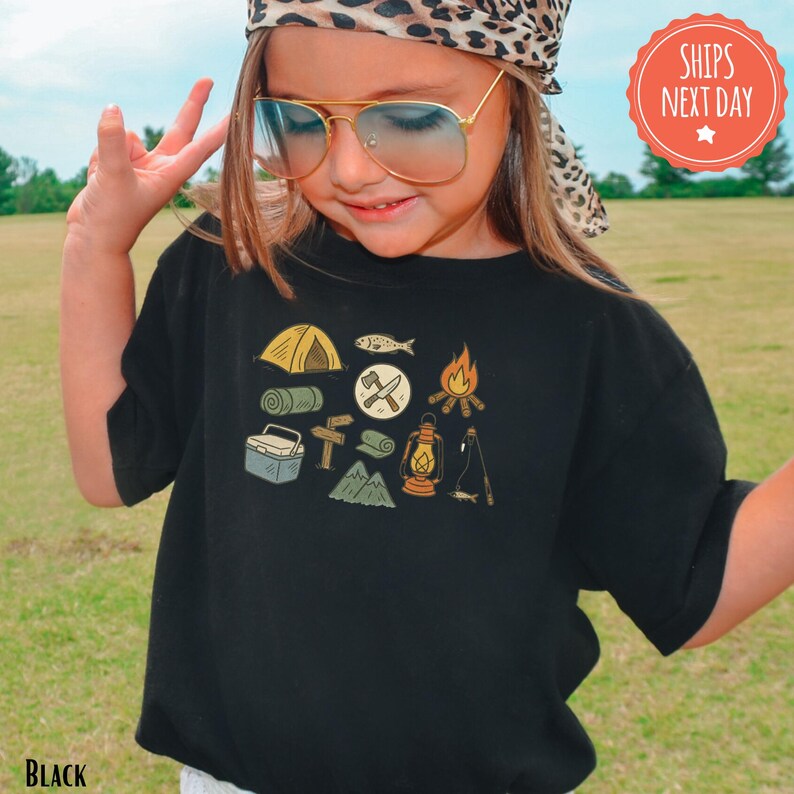 a little girl wearing sunglasses and a hat