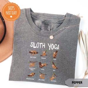 a hat, sunglasses, and t - shirt with the words sloth yoga on