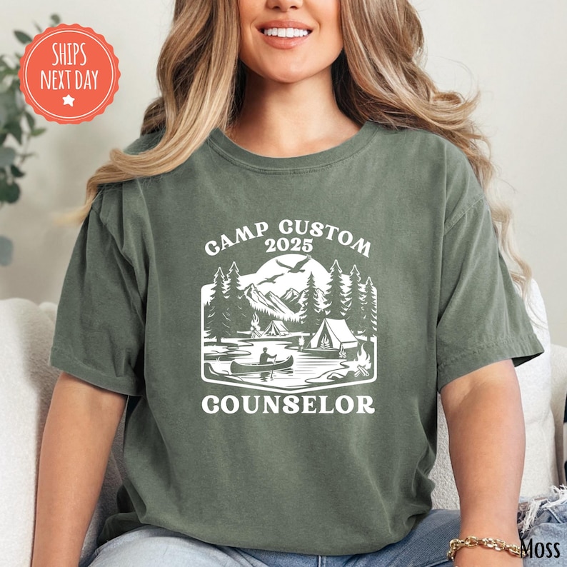 a woman sitting on a couch wearing a t - shirt