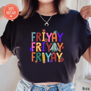 A person wearing a black t-shirt with a colorful graphic design that says "FRYAYAY FRYAYAY" printed on it.