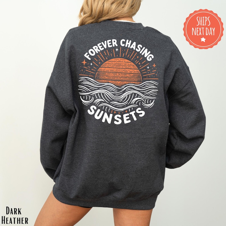 a woman wearing a sweatshirt that says forever chasing sunsets