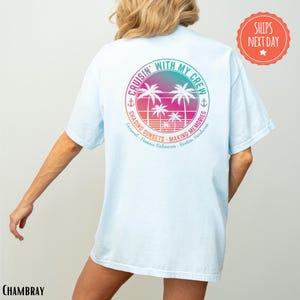 a person wearing a white t-shirt with a colorful graphic design on the back.