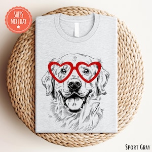 a t - shirt with a picture of a dog wearing heart glasses