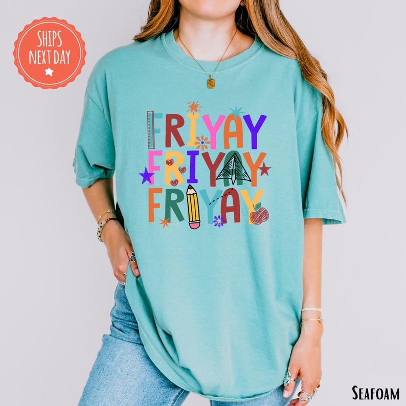 A woman wearing a teal t-shirt with the text "FRYAY FRYAY FRYAY" printed on it.