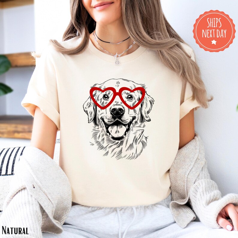 a woman wearing a t - shirt with a dog wearing glasses