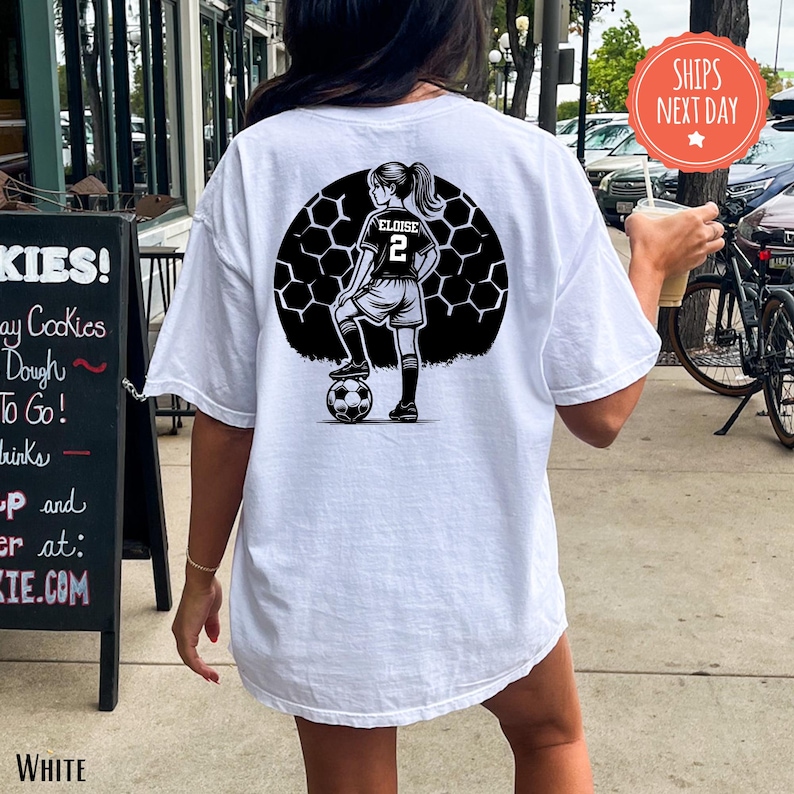 a woman wearing a purple soccer mom t - shirt