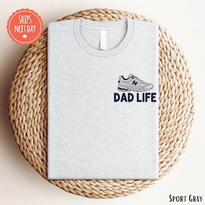 a t - shirt with the words dad life on it