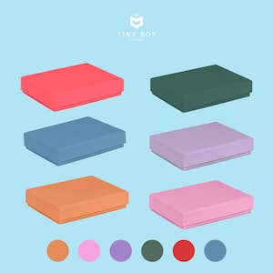May include: Six colourful, square boxes in shades of red, green, blue, purple, orange, and pink. The boxes are arranged on a light blue background, with a colour palette of matching circles below. The text "TINY BOX COMPANY" is at the top.
