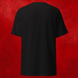 May include: A black short-sleeved t-shirt with a crew neck.