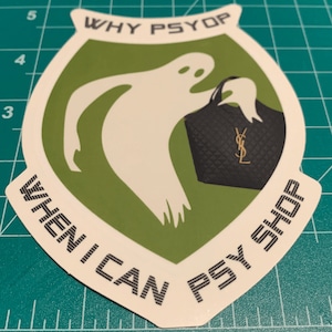 May include: A green and white sticker with a ghost holding a black purse with a gold YSL logo. The sticker says "WHY PSYOP WHEN I CAN PSY SHOP".