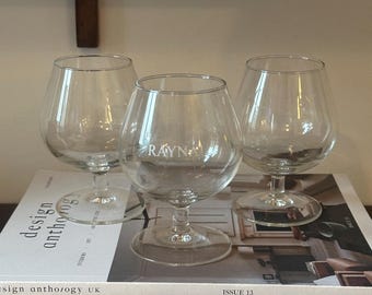 Juego de 3 copas de brandy Raynal Arc France de cristal transparente con tallo corto.
