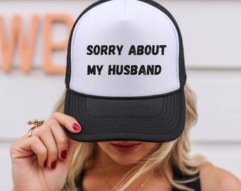 Funny Sorry About My Husband Black Trucker Hat - Wife Gag Gift, Sarcastic Spouse Hat, Relatable Marriage Accessory, Husband Burn Gift