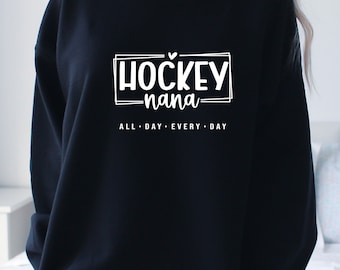 May include: Black sweatshirt with white text that reads "HOCKEY nana ALL DAY EVERY DAY" with a small heart above the word "HOCKEY".