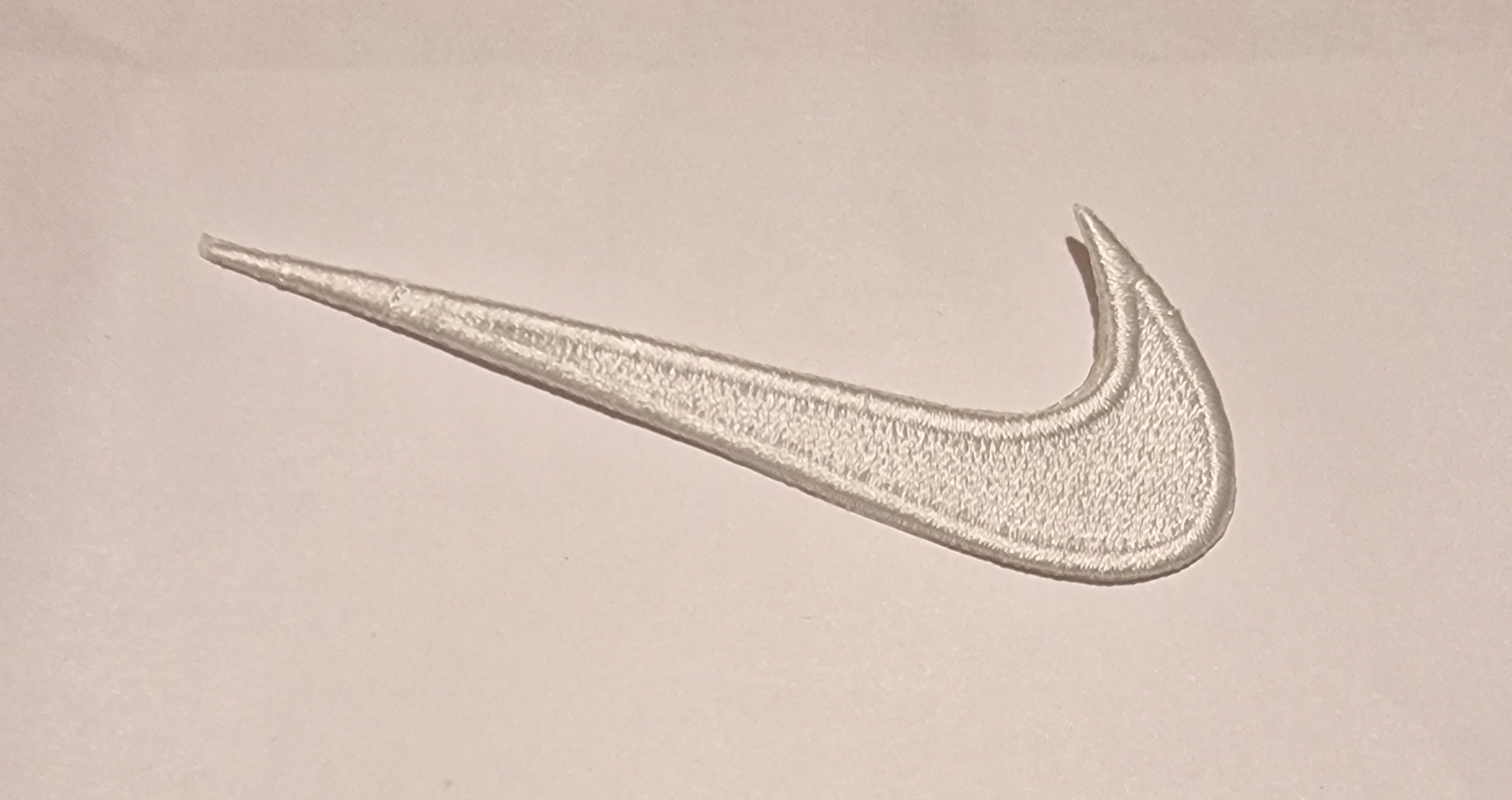 Backwards Nike Logo Meaning