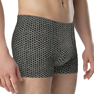 May include: Black and silver patterned boxer shorts. The pattern resembles chainmail.